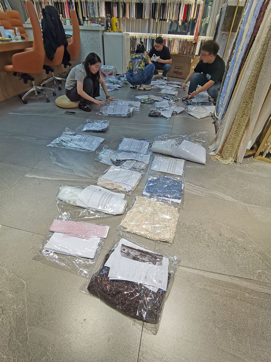 Our team reviewing fabric items and order details for a long-standing customer